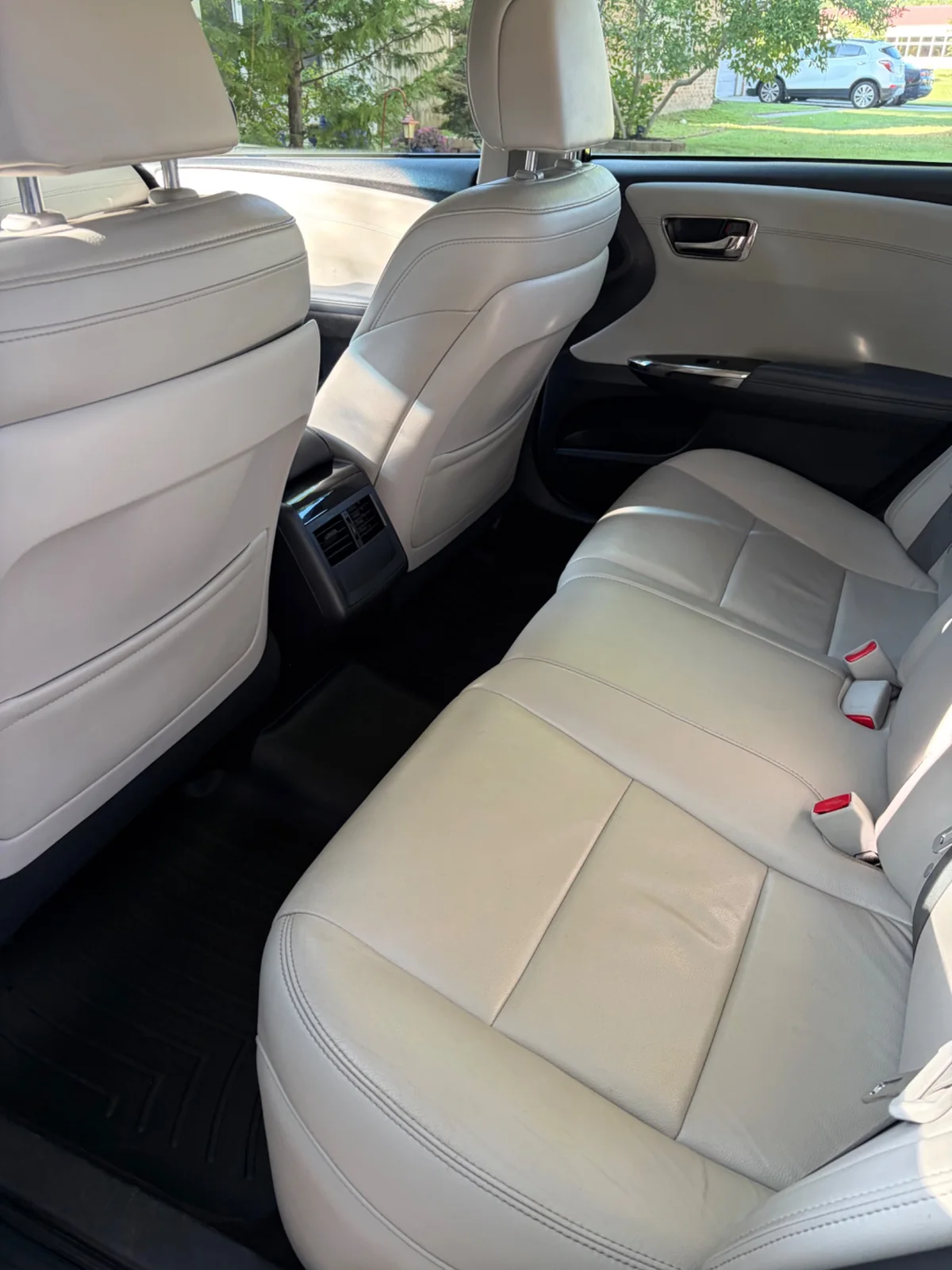 Clean light leather rear vehicle interior